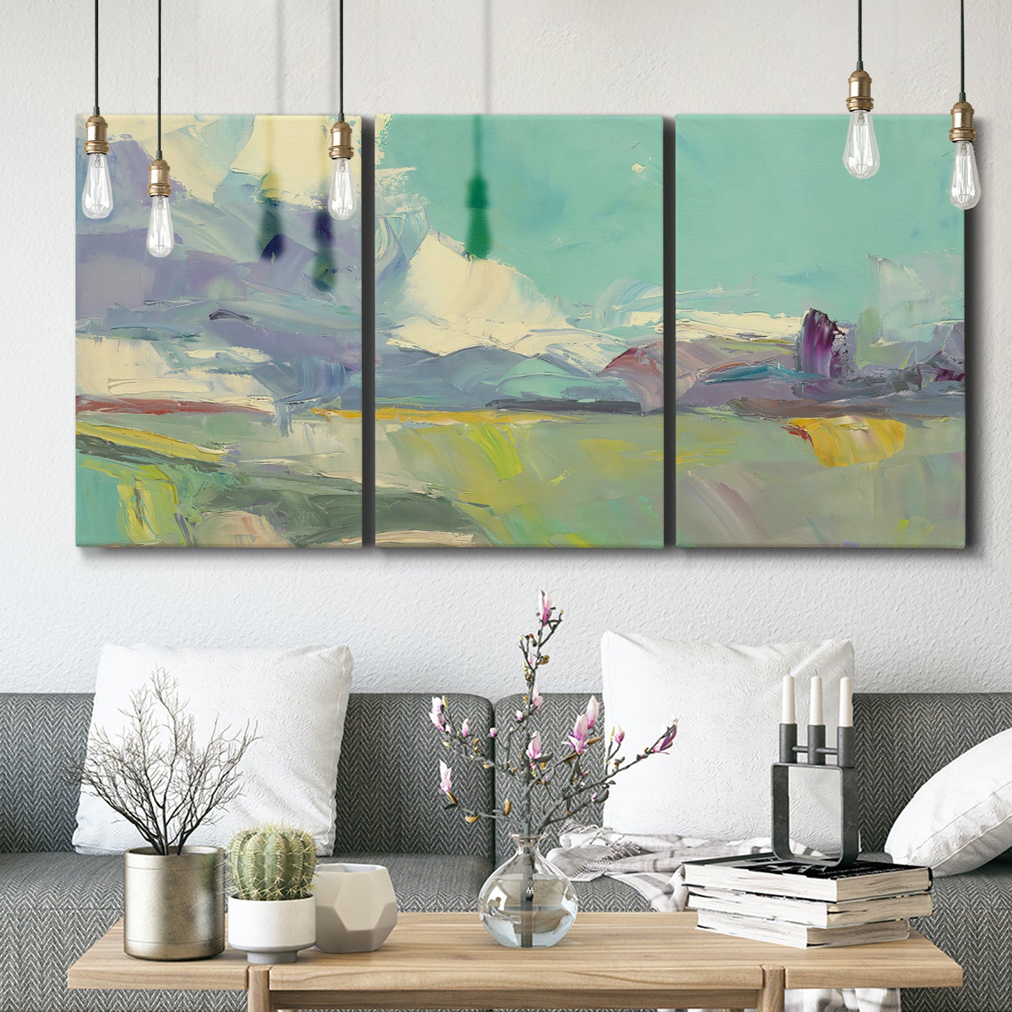 Three-panel canvas wall art featuring road stretching through open countryside, displayed in a modern living room above seating.