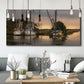 Three-panel canvas wall art featuring fishing trawlers on working harbor, displayed in a modern living room above seating.