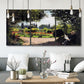 Three-panel canvas wall art featuring coastal garden overlooking sea, displayed in a modern living room above seating.