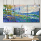 Three-panel canvas wall art featuring cheerful landscape under open sky, displayed in a modern living room above seating.