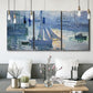 Three-panel canvas wall art featuring sailboats racing on river, displayed in a modern living room above seating.