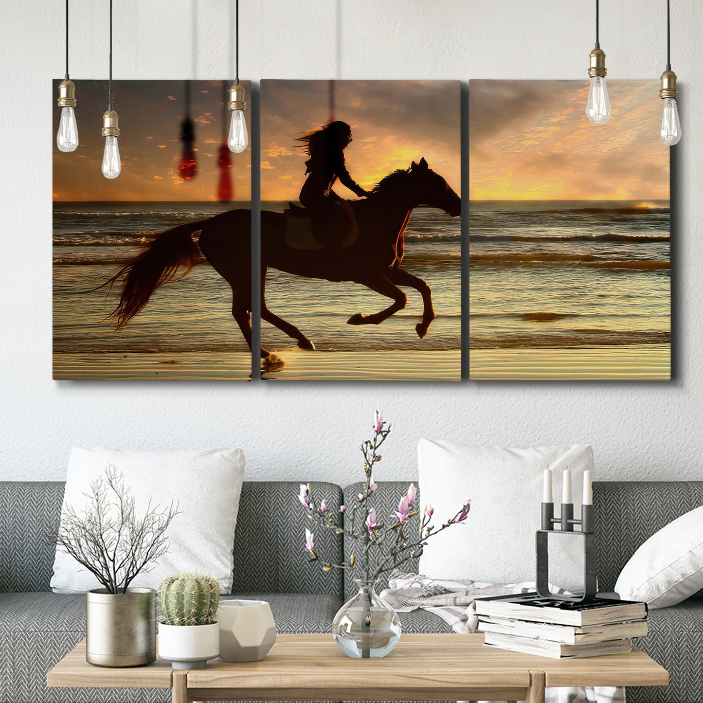 Three-panel canvas wall art featuring running horse along beach photograph, displayed in a modern living room above seating.