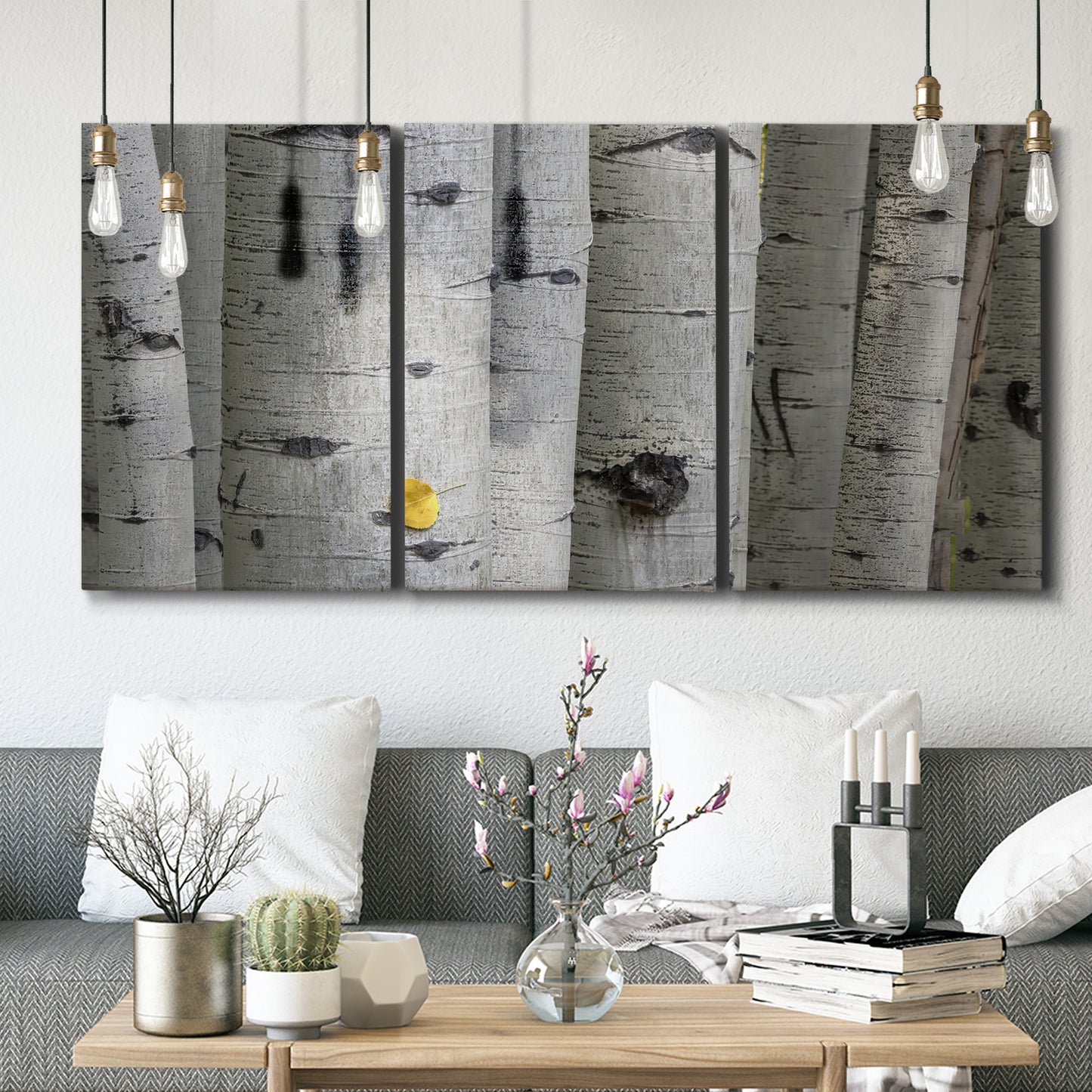 Three-panel canvas wall art featuring close up tree bark texture photograph, displayed in a modern living room above seating.