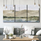 Three-panel canvas wall art featuring desert mountain landscape watercolor, displayed in a modern living room above seating.