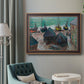 Impressionist coastal beach scene with boats by Claude Monet in an ornate bronzed mahogany wood frame displayed in a bright interior setting.