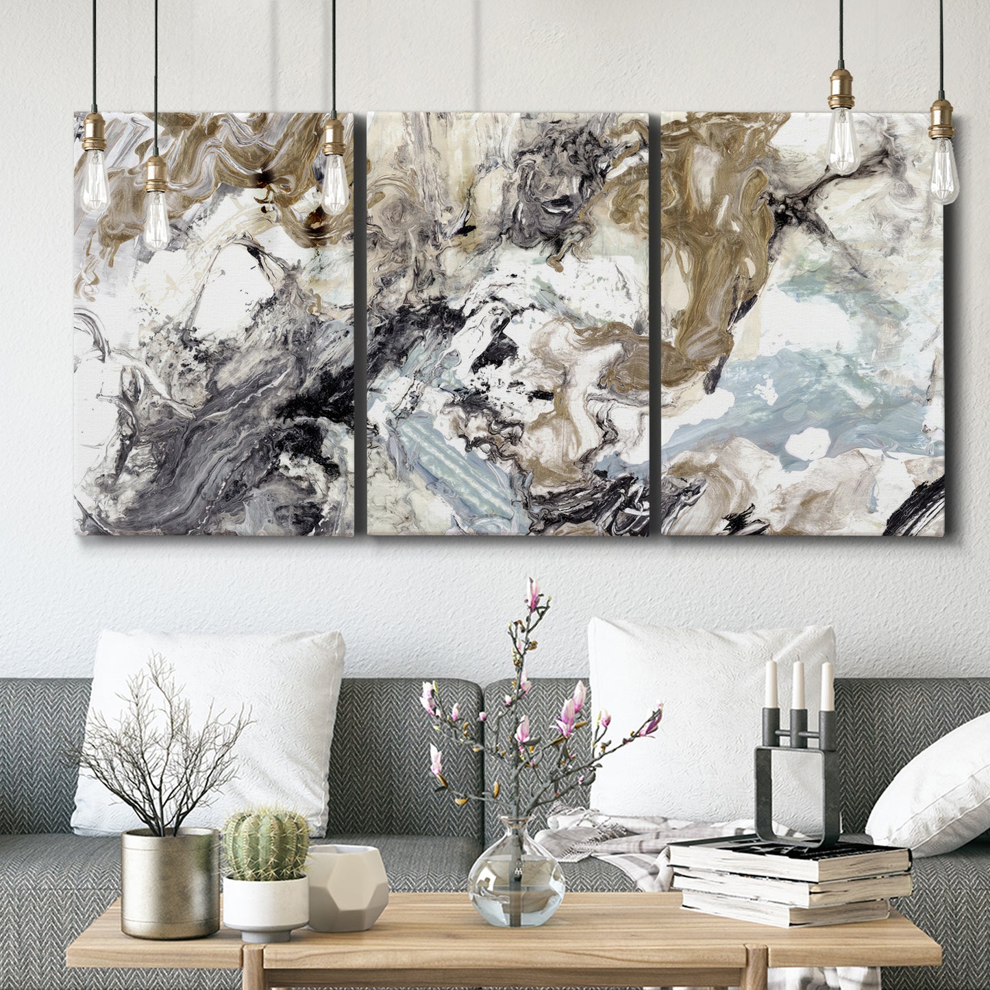 Three-panel canvas wall art featuring marbled modern abstract textures, displayed in a modern living room above seating.