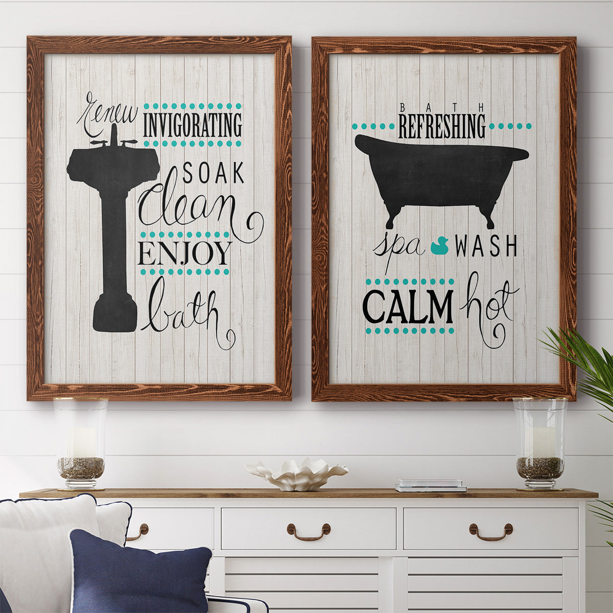 Set of two maple barnwood framed canvas prints depicting a coordinated art pair of playful bathtub silhouettes and bath-themed typography rendered as graphic bathroom word art above a dining room sideboard.