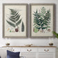 Set of two gray barnwood framed canvas prints depicting a coordinated art pair of vintage fern specimens with botanical details rendered as natural-history fern plates above a dining room sideboard.