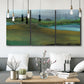 Three-panel canvas wall art featuring quiet contemplative landscape scene, displayed in a modern living room above seating.