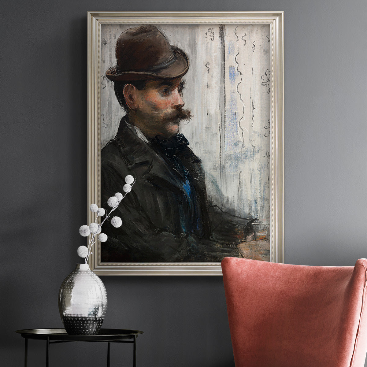 Impressionist portrait of a seated man by Édouard Manet in an ornate champagne frame displayed in a dark-toned interior setting.