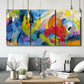 Three-panel canvas wall art featuring colorful abstract racing forms, displayed in a modern living room above seating.