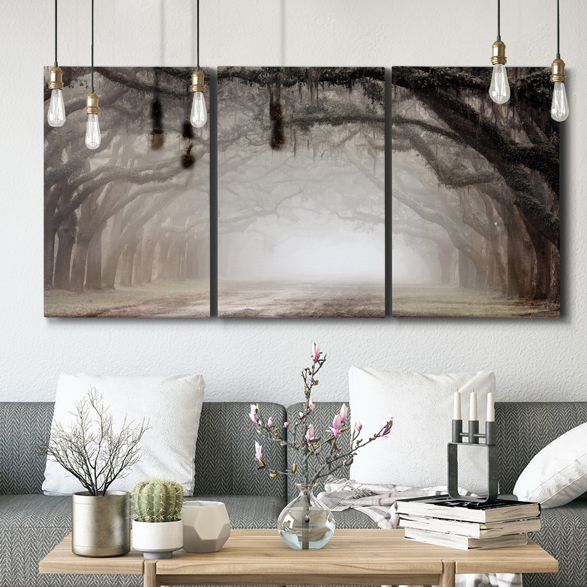 Three-panel canvas wall art featuring tree lined plantation road, displayed in a modern living room above seating.