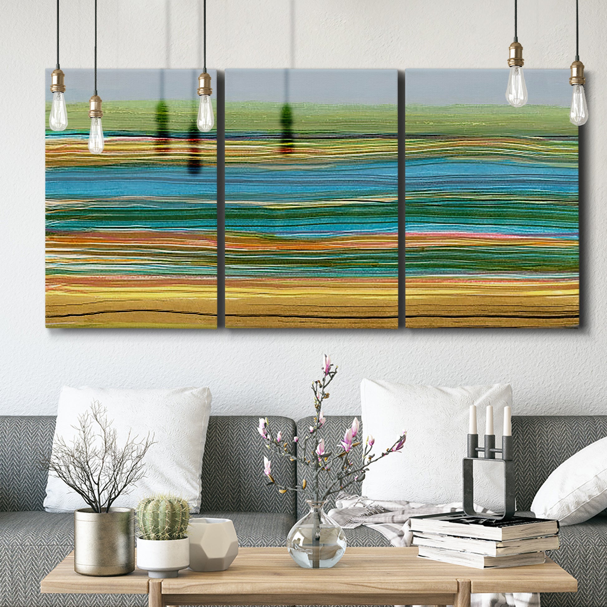 Three-panel canvas wall art featuring parallel linear abstract striations, displayed in a modern living room above seating.