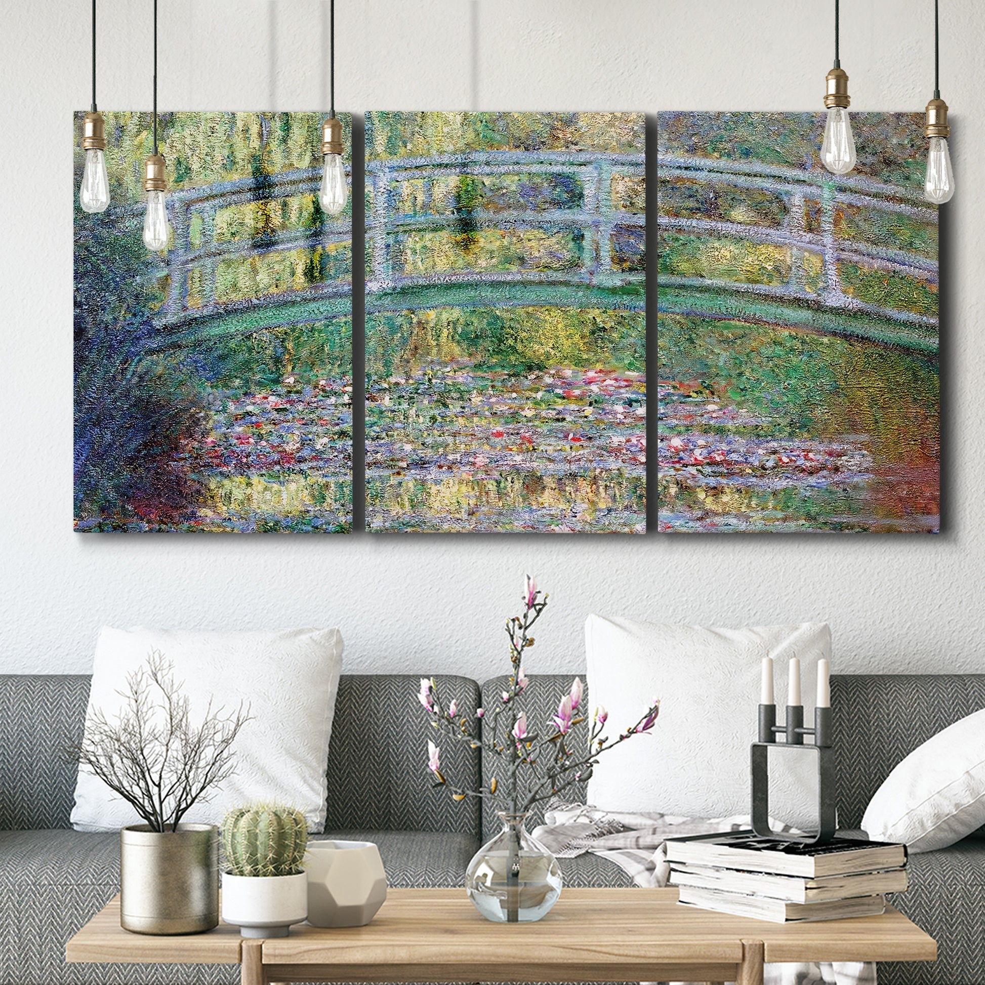 Three-panel canvas wall art featuring water lilies with arched bridge, displayed in a modern living room above seating.