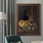 Realist still life with figs and bread by Luis Meléndez in an ornate bronzed mahogany wood frame displayed in a dark-toned interior setting.