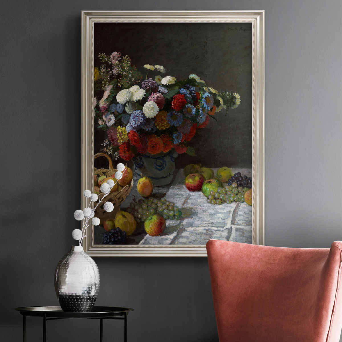 Impressionist floral still life painting by Claude Monet in an ornate champagne frame displayed in a dark-toned interior setting.