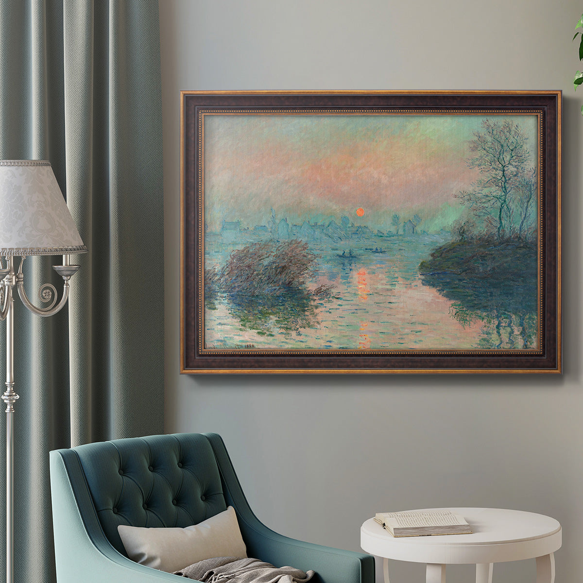 Impressionist winter river sunset scene by Claude Monet in an ornate bronzed mahogany wood frame displayed in a bright interior setting.