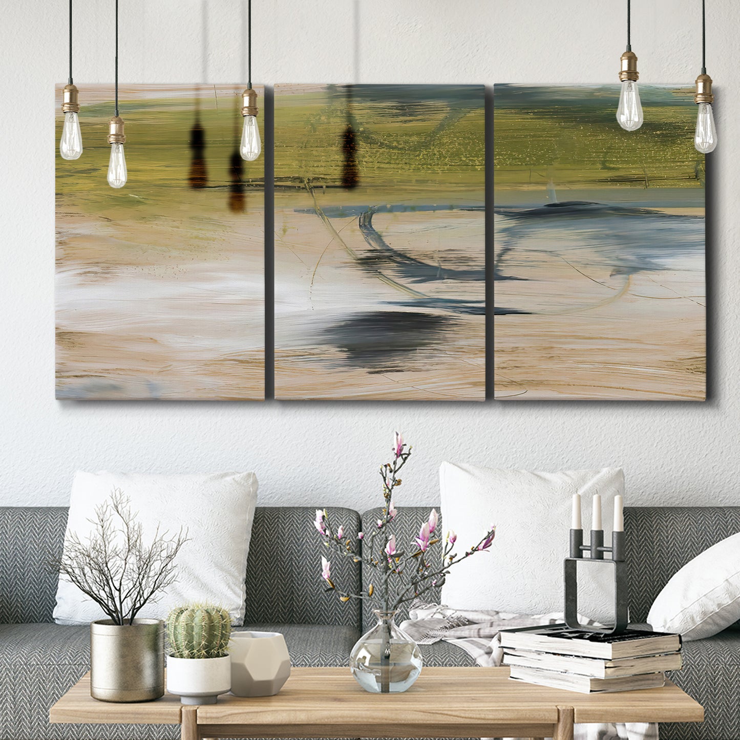 Three-panel canvas wall art featuring minimal abstract water reflections, displayed in a modern living room above seating.