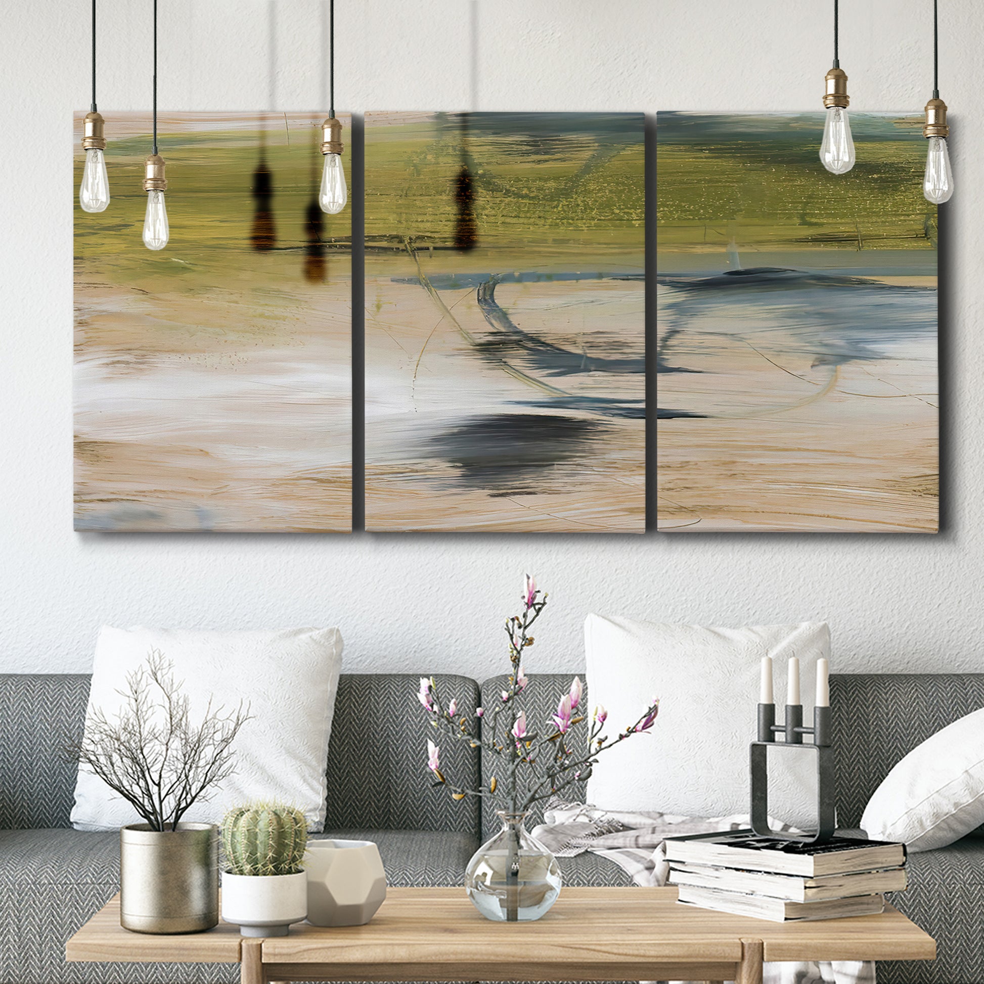 Three-panel canvas wall art featuring minimal abstract water reflections, displayed in a modern living room above seating.