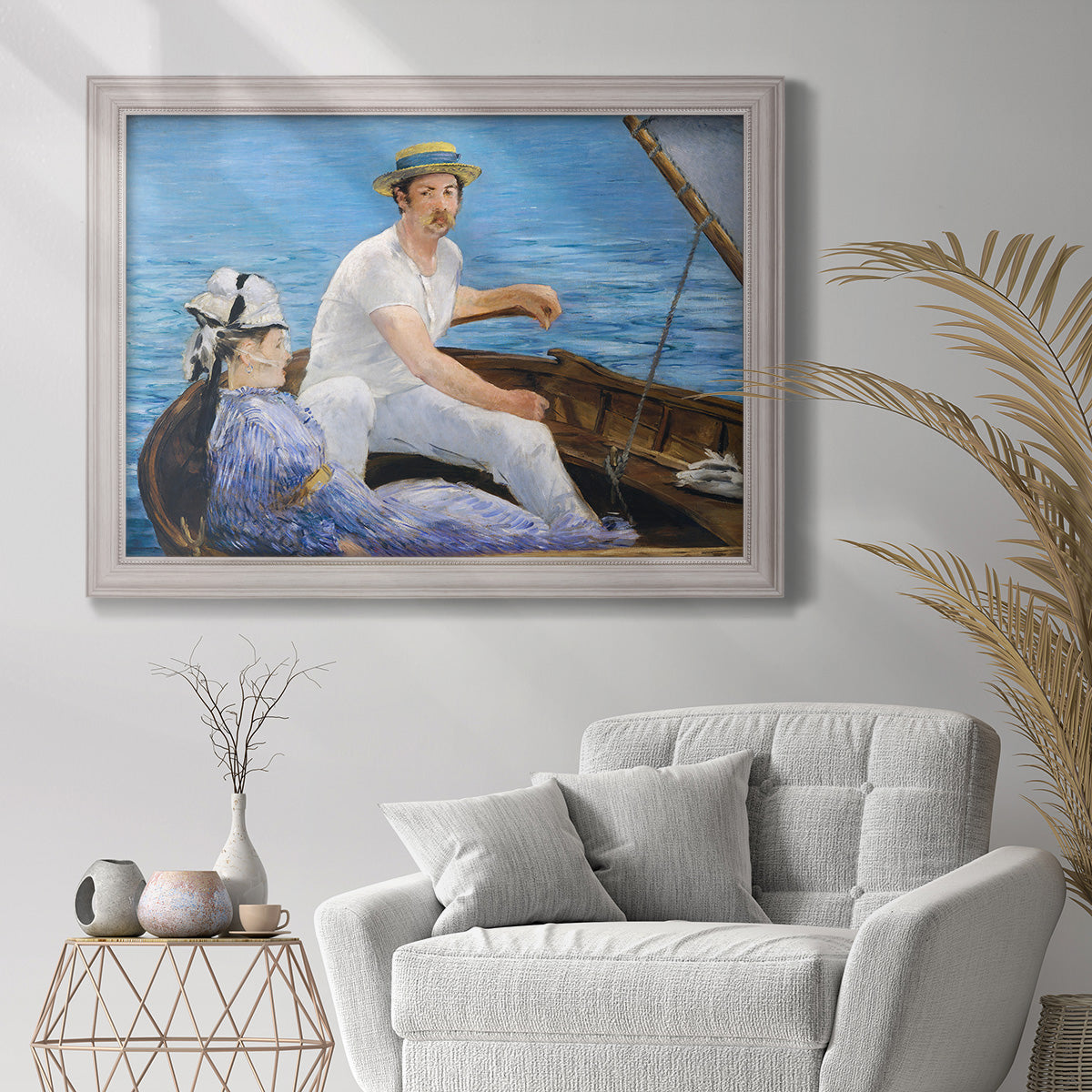 Impressionist leisure boating scene by Édouard Manet in an ornate weathered white frame displayed in a bright interior setting.