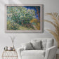 Impressionist lilac flower painting by Vincent van Gogh in an ornate weathered white frame displayed in a bright interior setting.