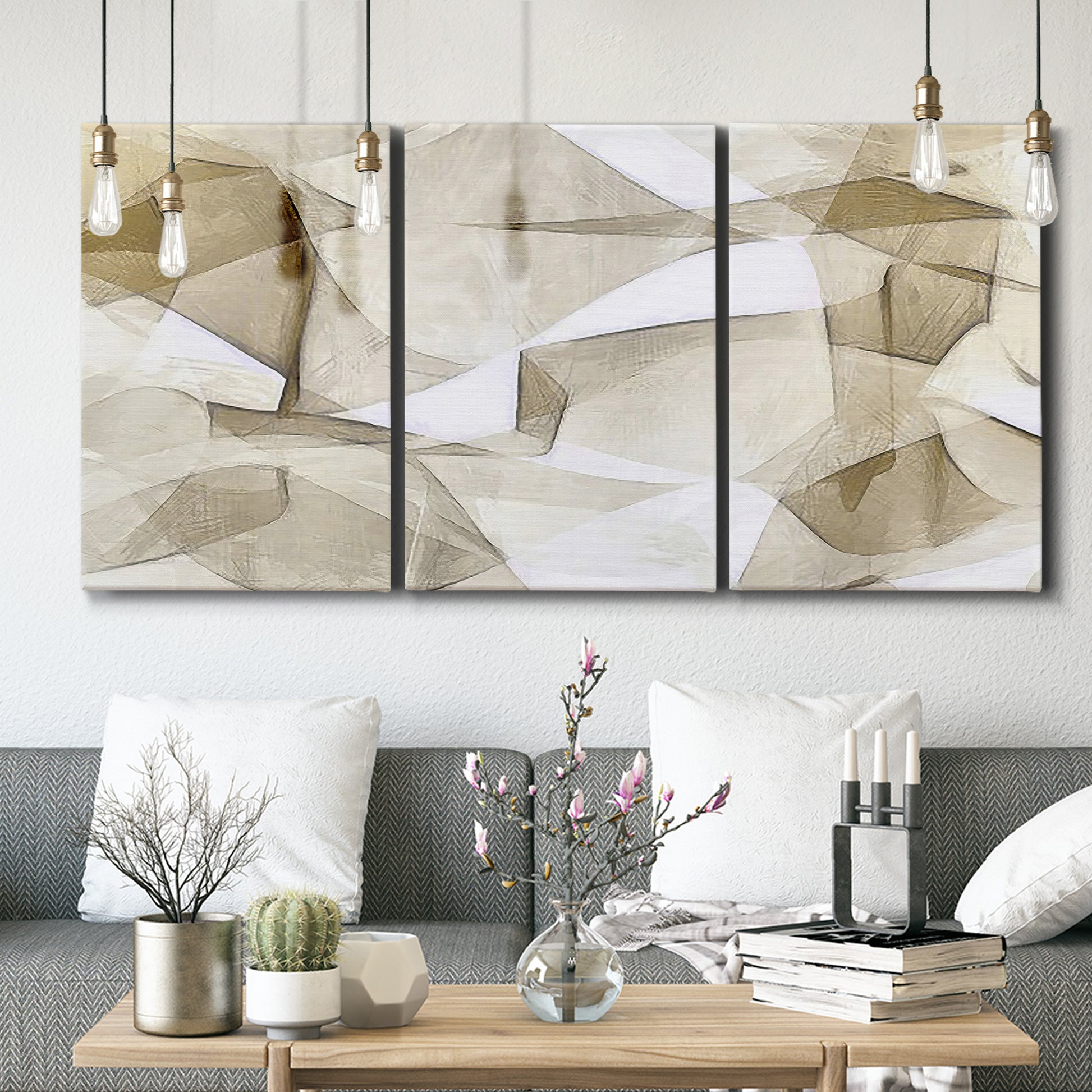 Three-panel canvas wall art featuring soft abstract meditative color balance, displayed in a modern living room above seating.