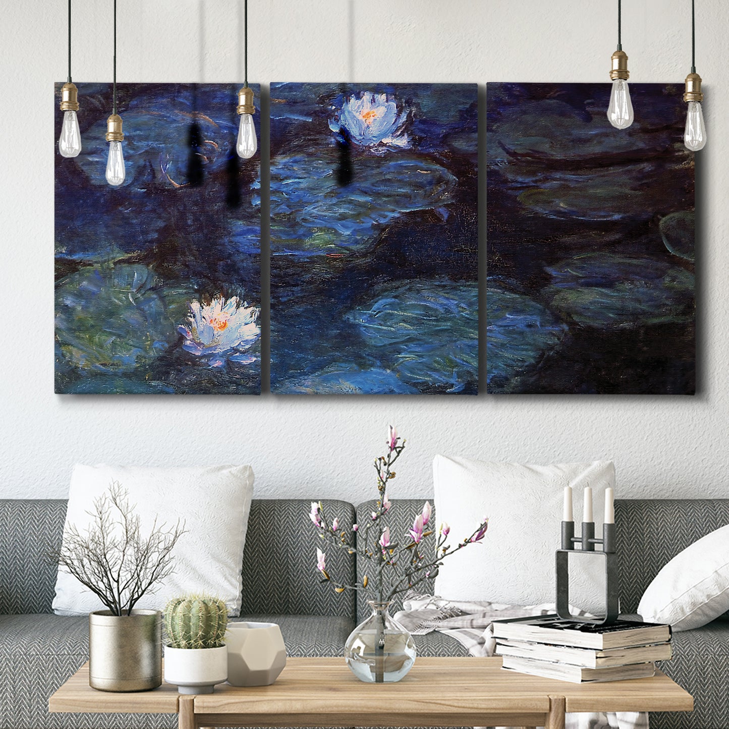 Three-panel canvas wall art featuring deep blue water lily reflections, displayed in a modern living room above seating.