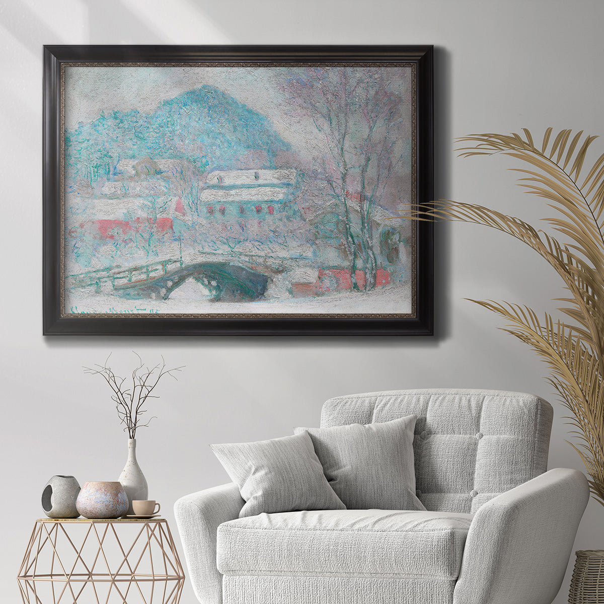 Impressionist coastal village landscape in Norway by Claude Monet in an ornate black frame with gilded inner detail displayed in a bright interior setting.