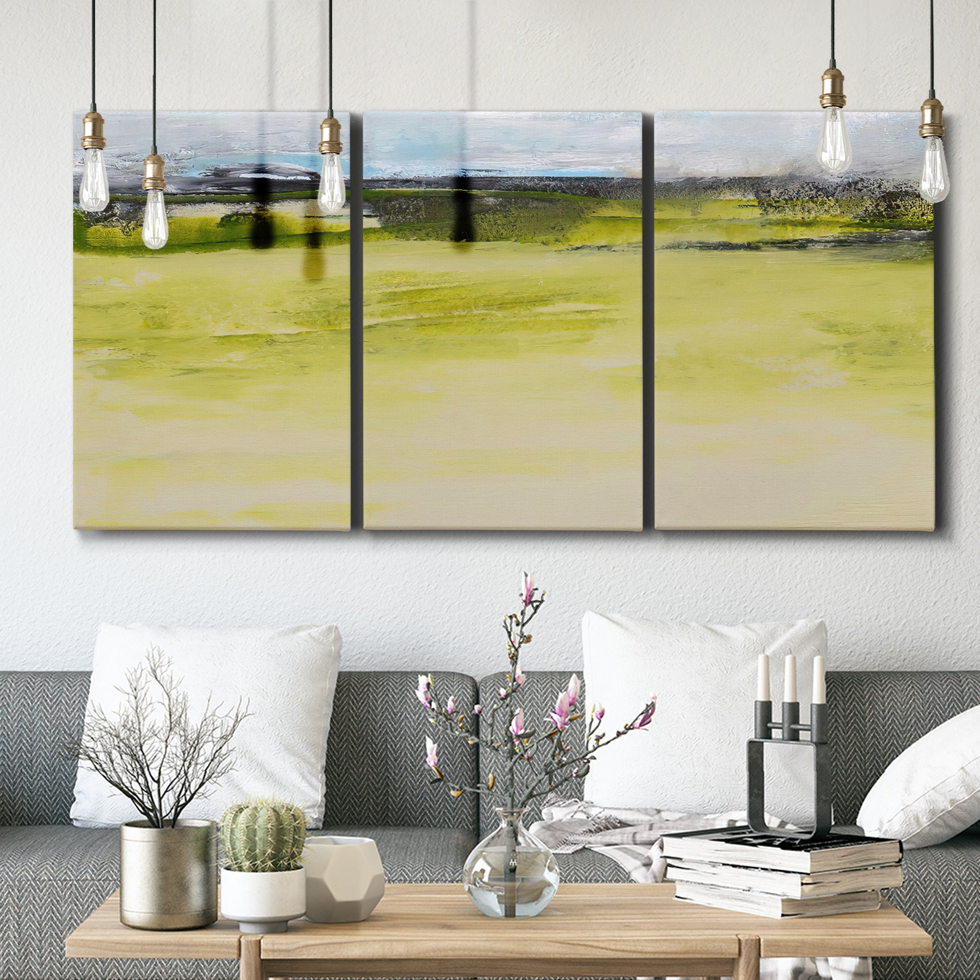 Three-panel canvas wall art featuring abstract terrace landscape view, displayed in a modern living room above seating.
