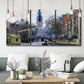 Three-panel canvas wall art featuring historic tower beside canal, displayed in a modern living room above seating.