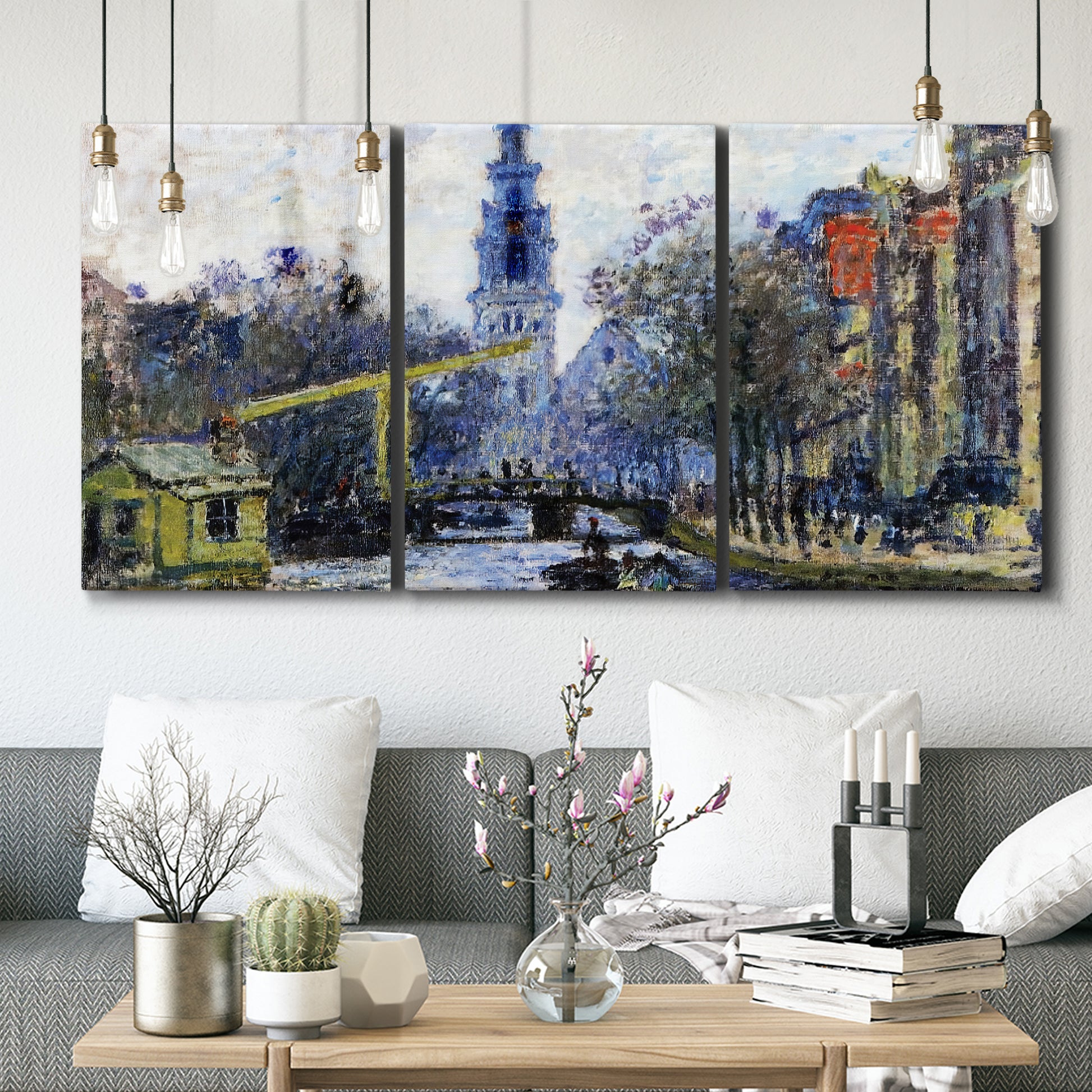 Three-panel canvas wall art featuring historic tower beside canal, displayed in a modern living room above seating.