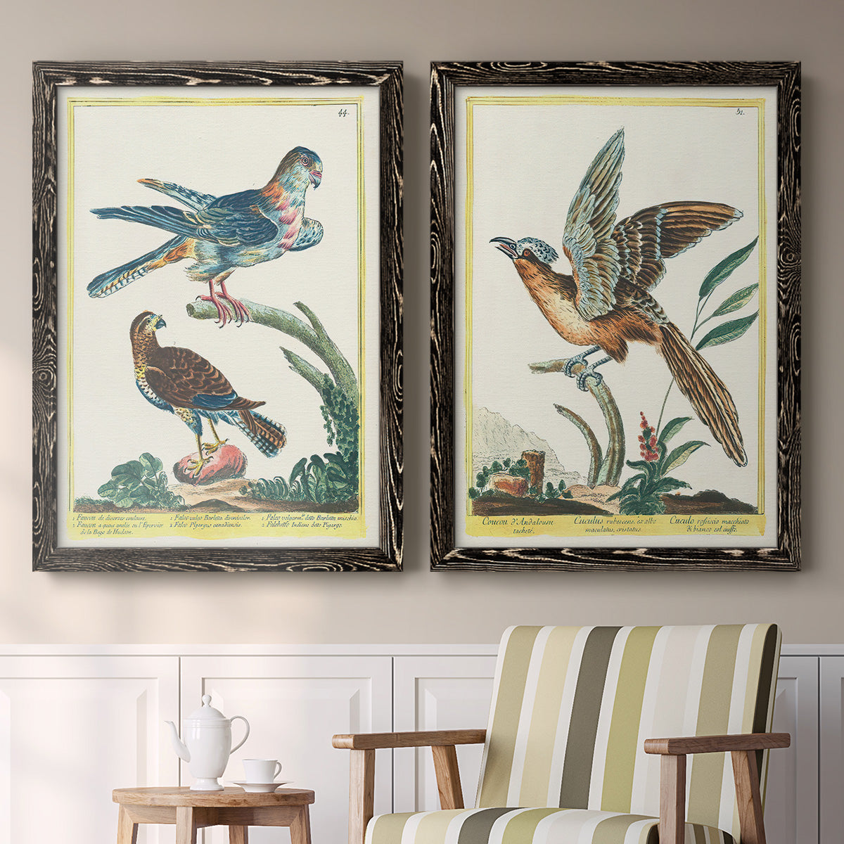 Set of two black barnwood framed canvas prints depicting two atmospheric abstract paintings featuring misty blue gray and violet marks hovering across pale grounds above a sideboard in a cozy sitting room.