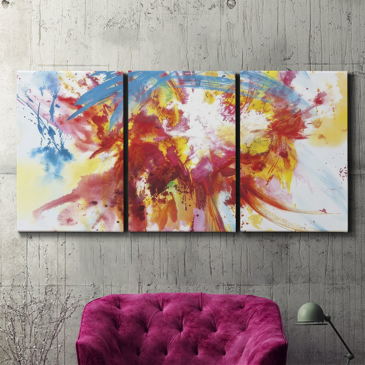Three-panel canvas wall art featuring bright abstract summer palette, displayed in a living room above a suede accent chair.