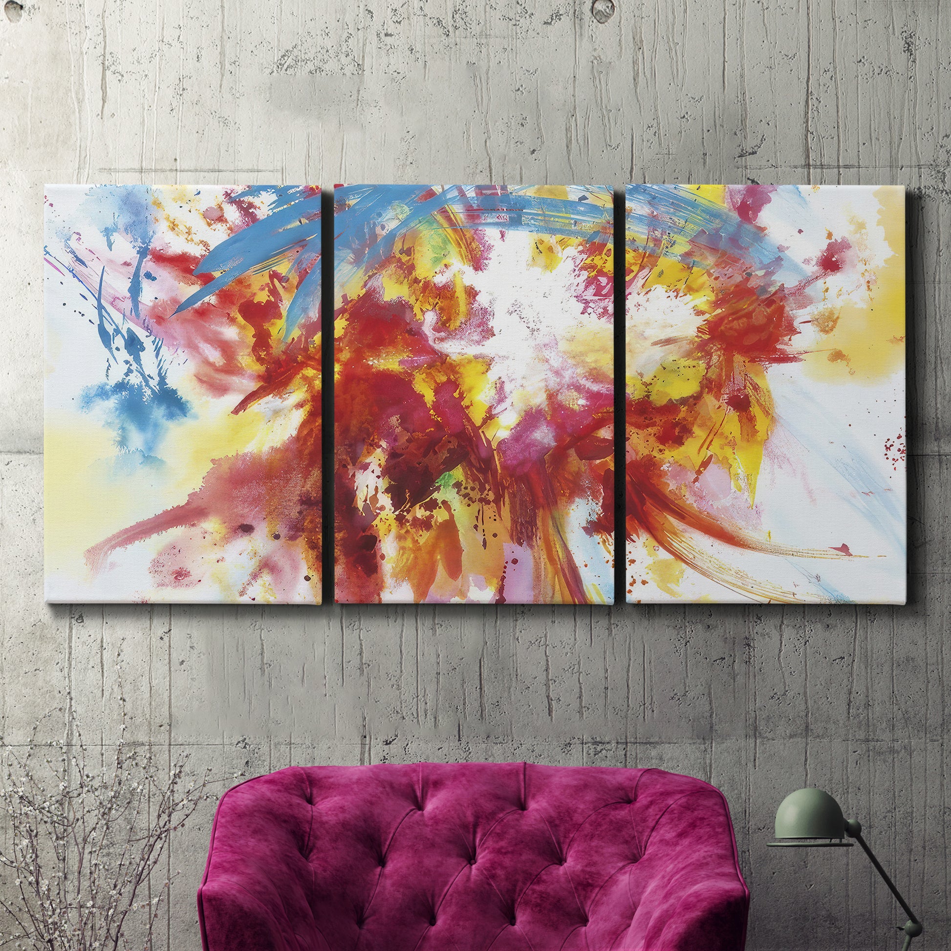 Three-panel canvas wall art featuring bright abstract summer palette, displayed in a living room above a suede accent chair.