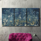Three-panel canvas wall art featuring dark abstract with rich tonal depth, displayed in a living room above a suede accent chair.