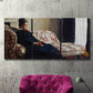 Three-panel canvas wall art featuring woman resting on sofa indoors, displayed in a living room above a suede accent chair.