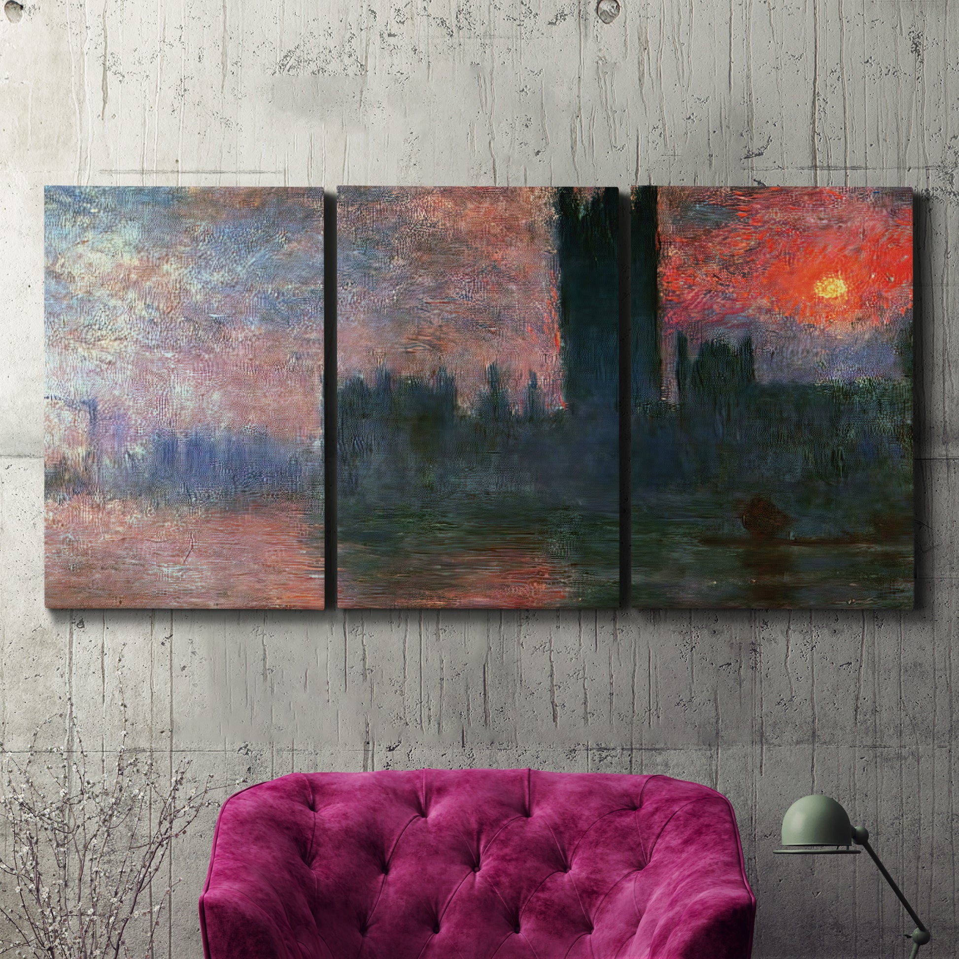 Three-panel canvas wall art featuring parliament silhouetted at dusk, displayed in a living room above a suede accent chair.