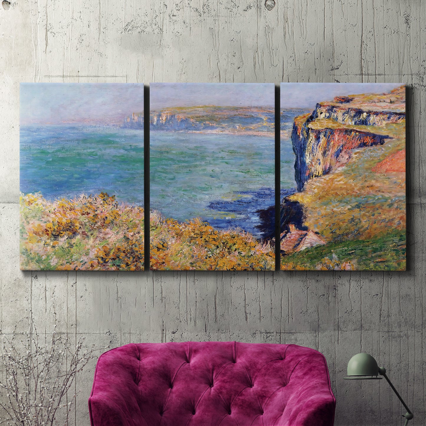 Three-panel canvas wall art featuring coastal village view near dieppe, displayed in a living room above a suede accent chair.