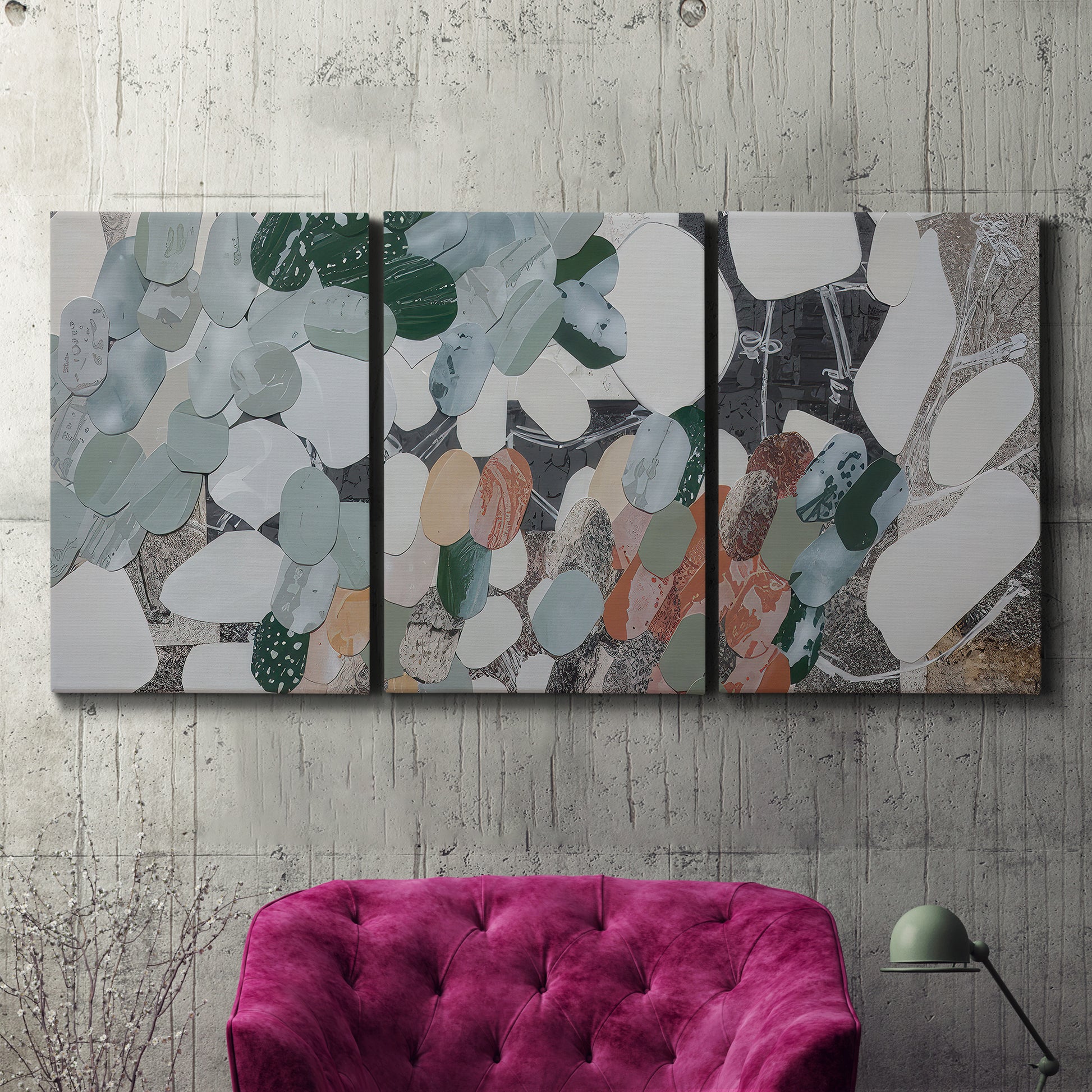 Three-panel canvas wall art featuring layered canyon inspired abstract forms, displayed in a living room above a suede accent chair.
