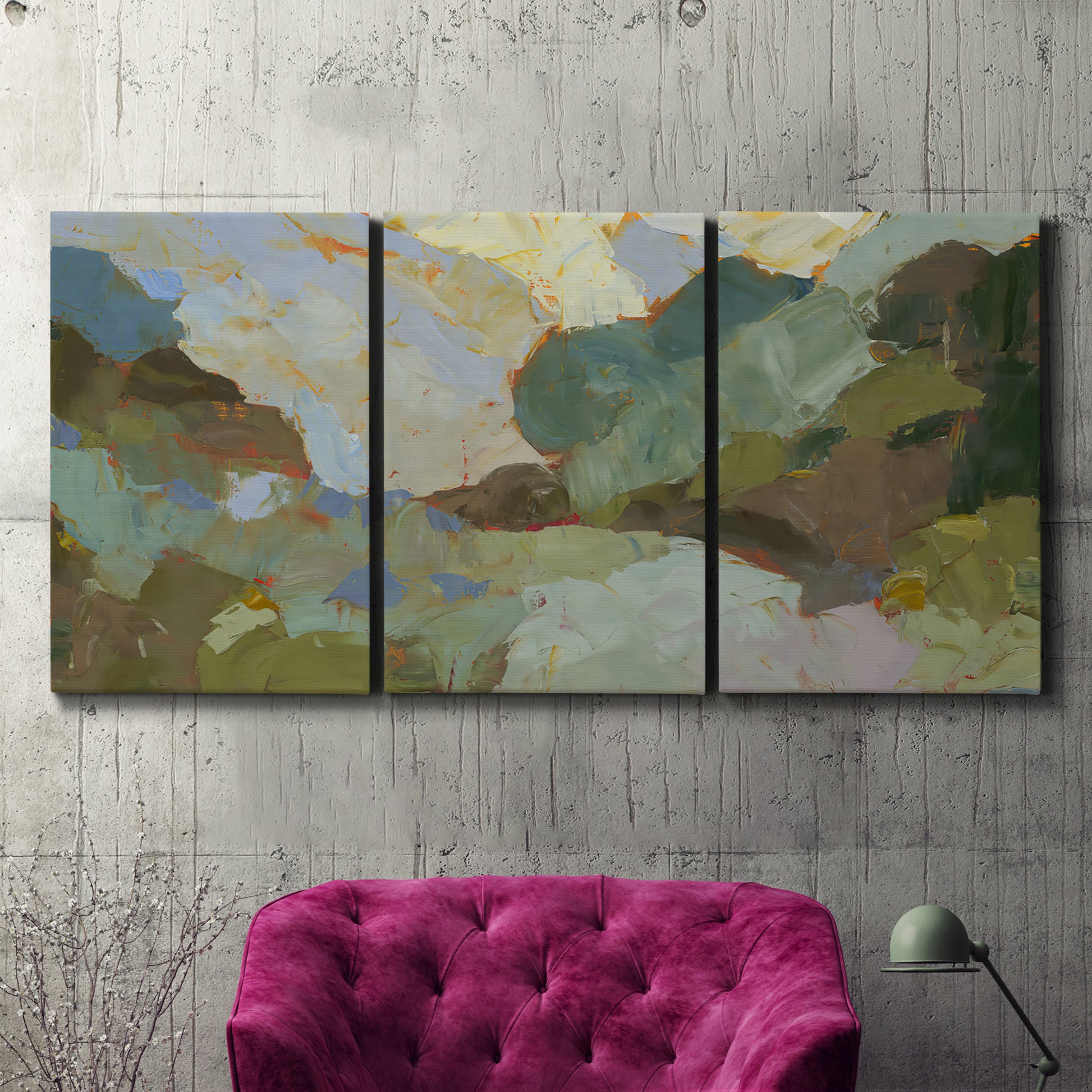 Three-panel canvas wall art featuring abstract landscape suggesting travel pause, displayed in a living room above a suede accent chair.