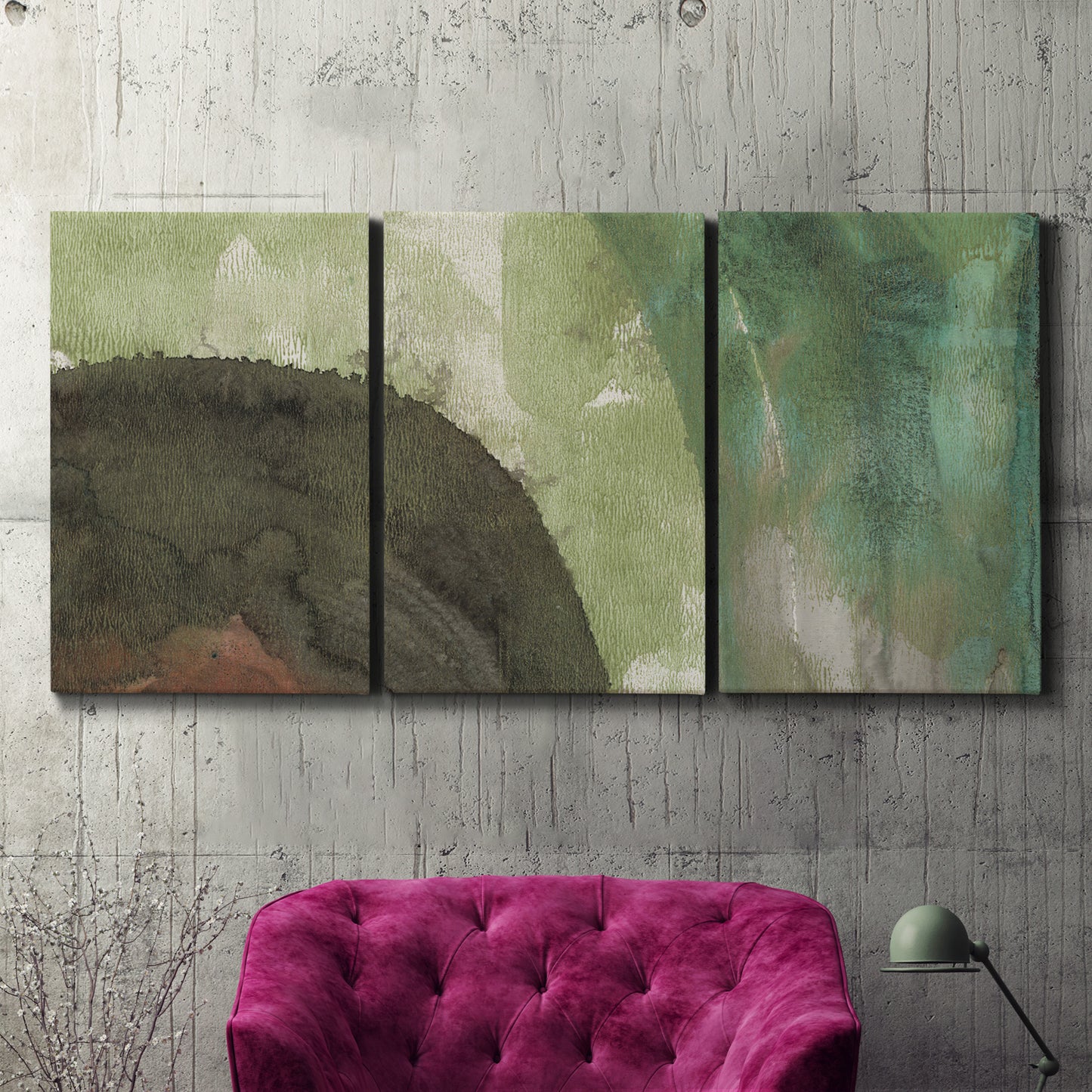 Three-panel canvas wall art featuring layered green abstract composition, displayed in a living room above a suede accent chair.
