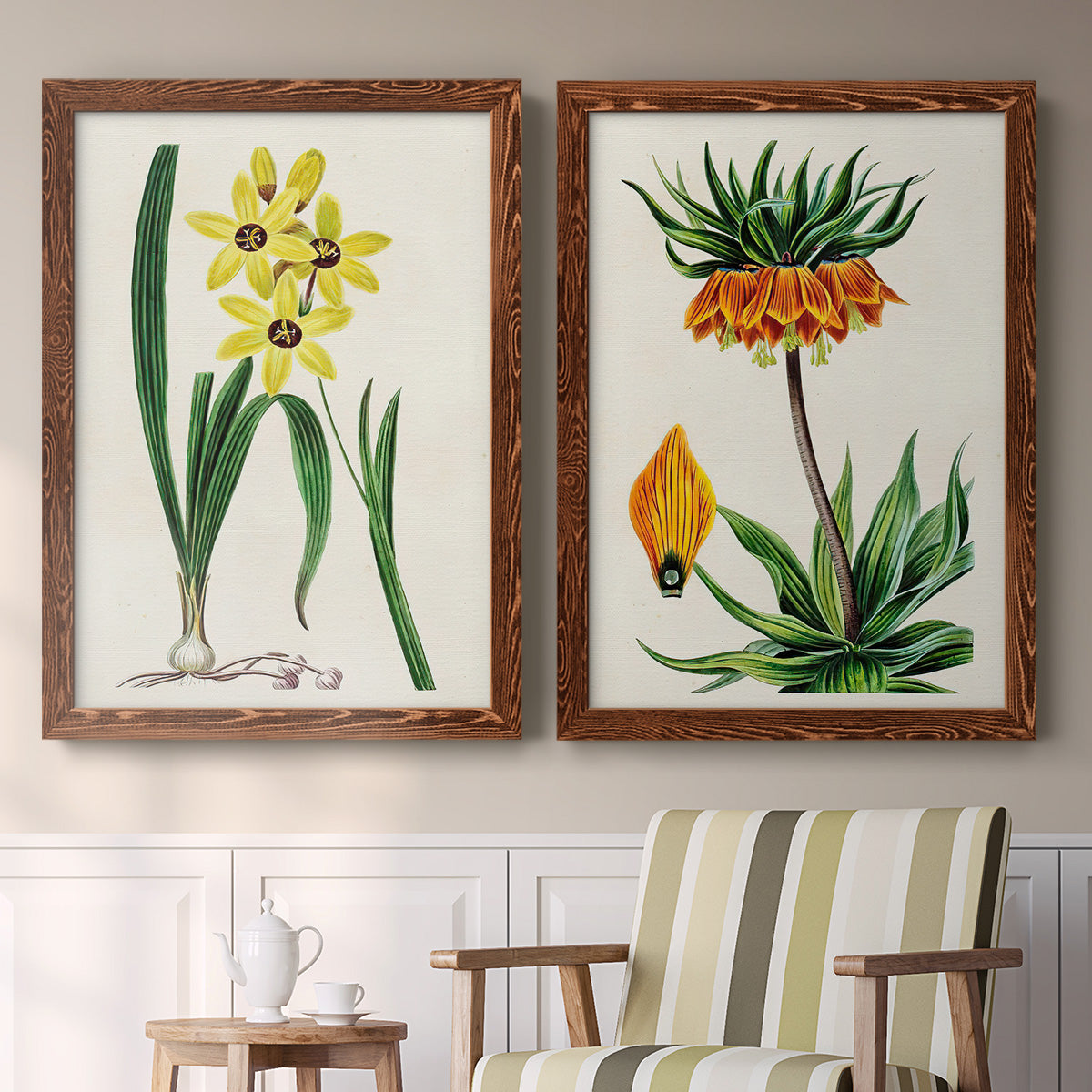 Set of two maple barnwood framed canvas prints depicting two antique botanical plate illustrations featuring colorful flowering plant specimens above a sideboard in a cozy sitting room.