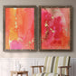 Set of two walnut barnwood framed canvas prints depicting two glamorous fluid abstracts featuring luminous coral orange and pink color fields with gold flecks above a sideboard in a cozy sitting room.