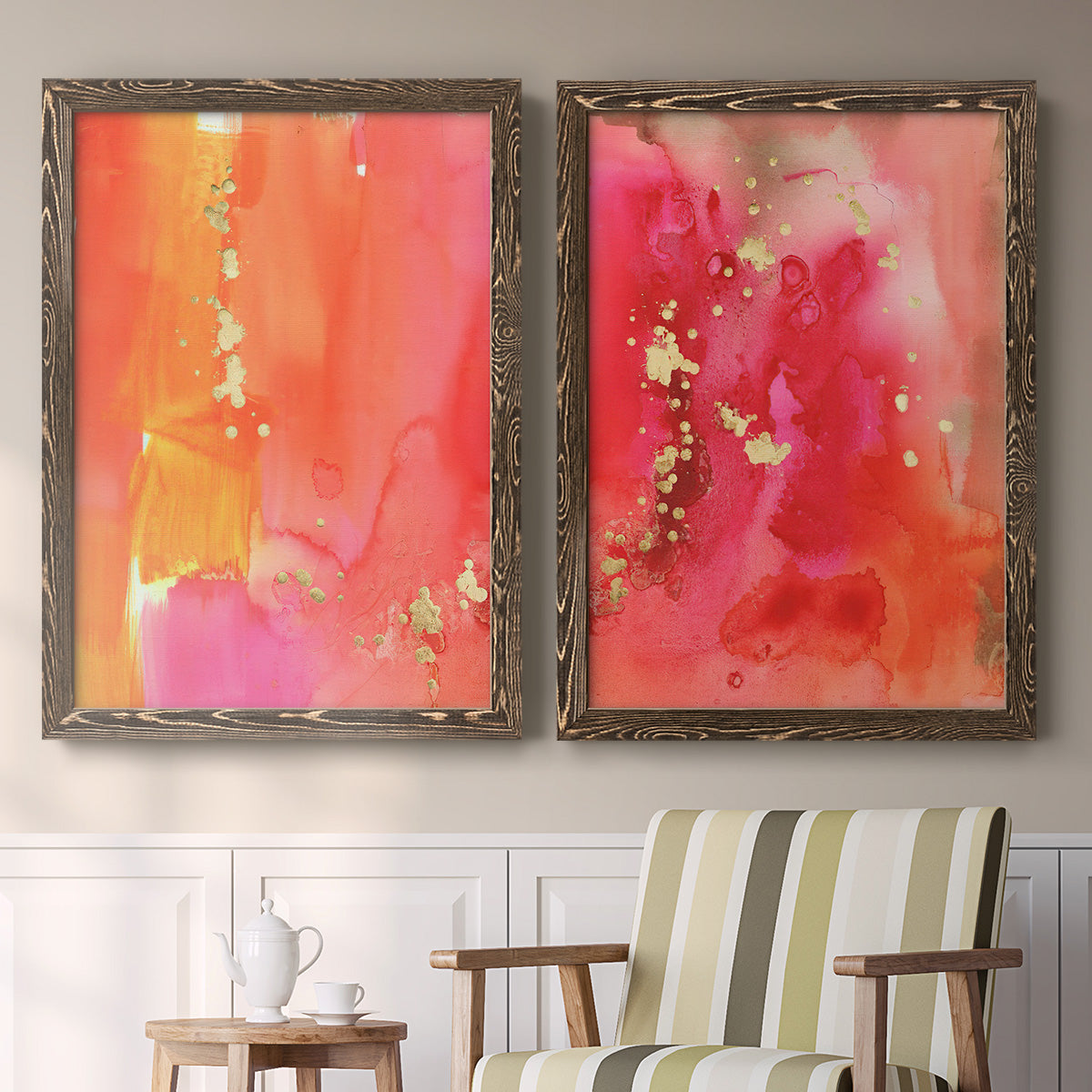 Set of two walnut barnwood framed canvas prints depicting two glamorous fluid abstracts featuring luminous coral orange and pink color fields with gold flecks above a sideboard in a cozy sitting room.