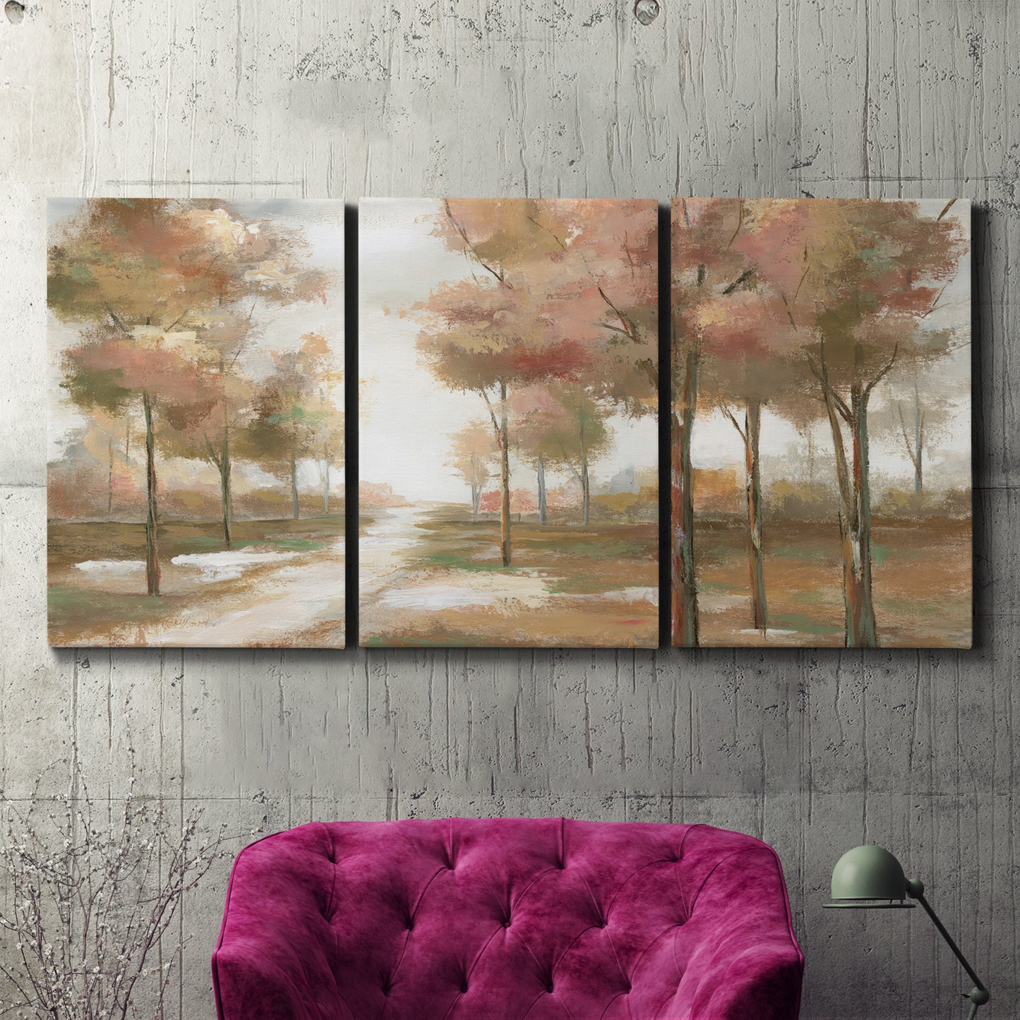 Three-panel canvas wall art featuring soft pastel park landscape scene, displayed in a living room above a suede accent chair.