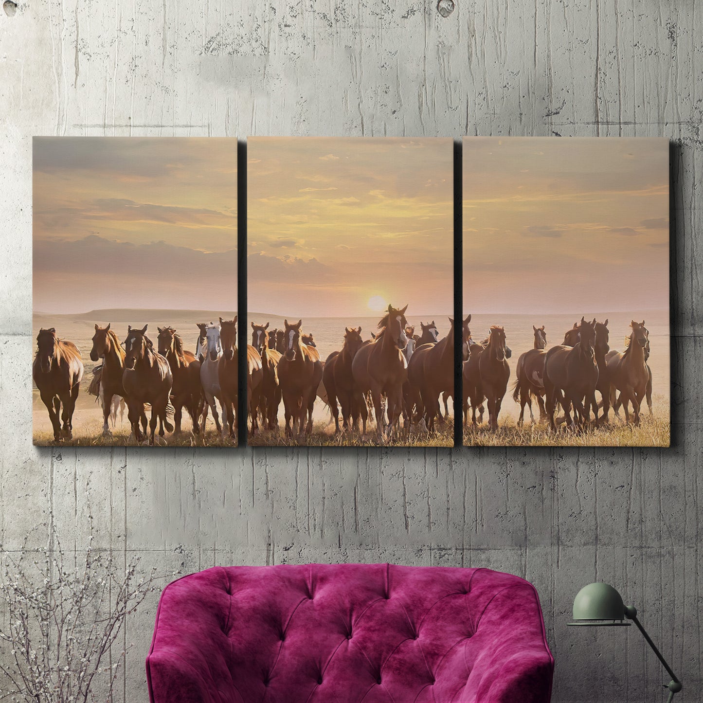 Three-panel canvas wall art featuring running horses captured in motion, displayed in a living room above a suede accent chair.
