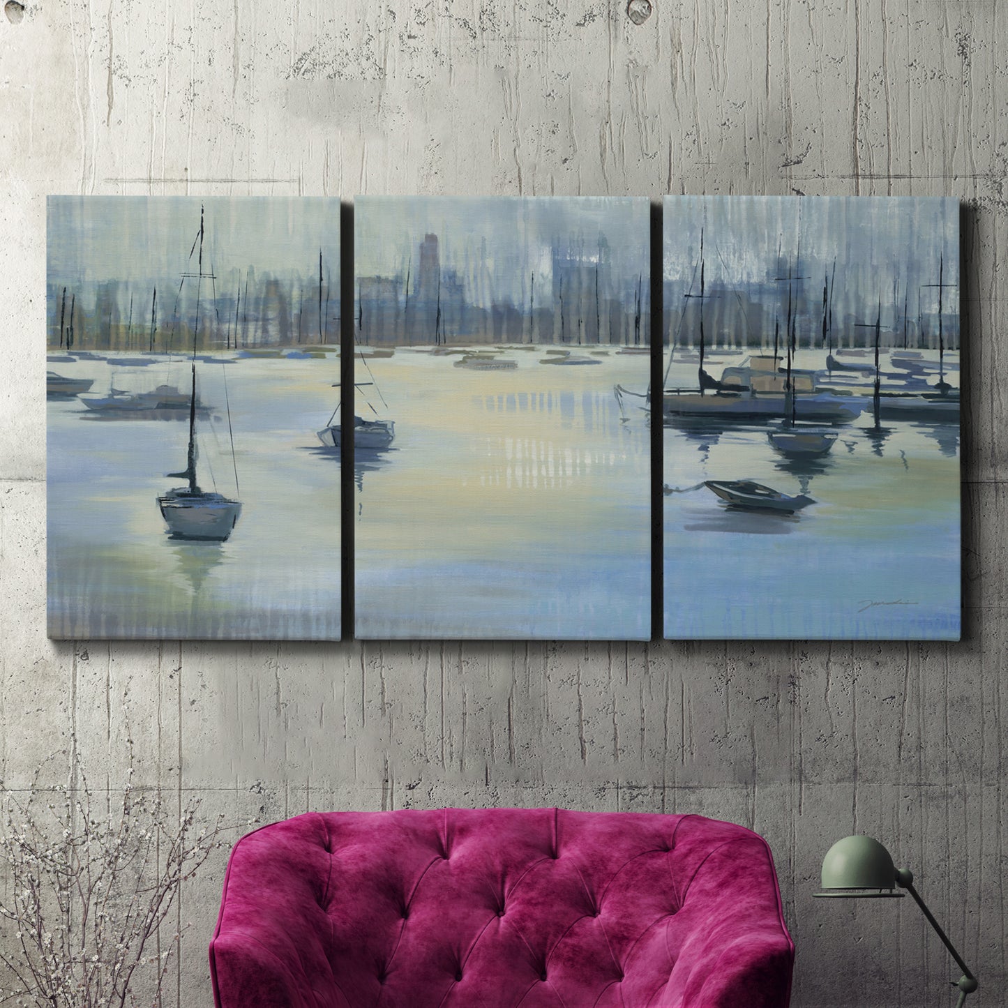 Three-panel canvas wall art featuring anchored boats near shoreline, displayed in a living room above a suede accent chair.