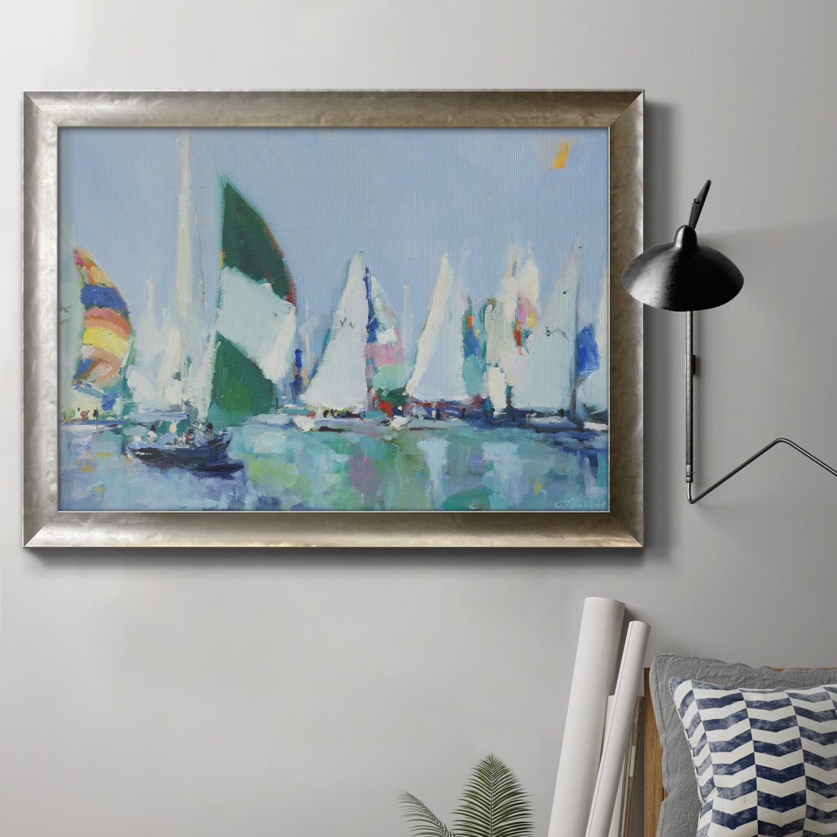 Coastal harbor watercolor painting in an ornate mottled silver frame displayed in a neutral interior setting.