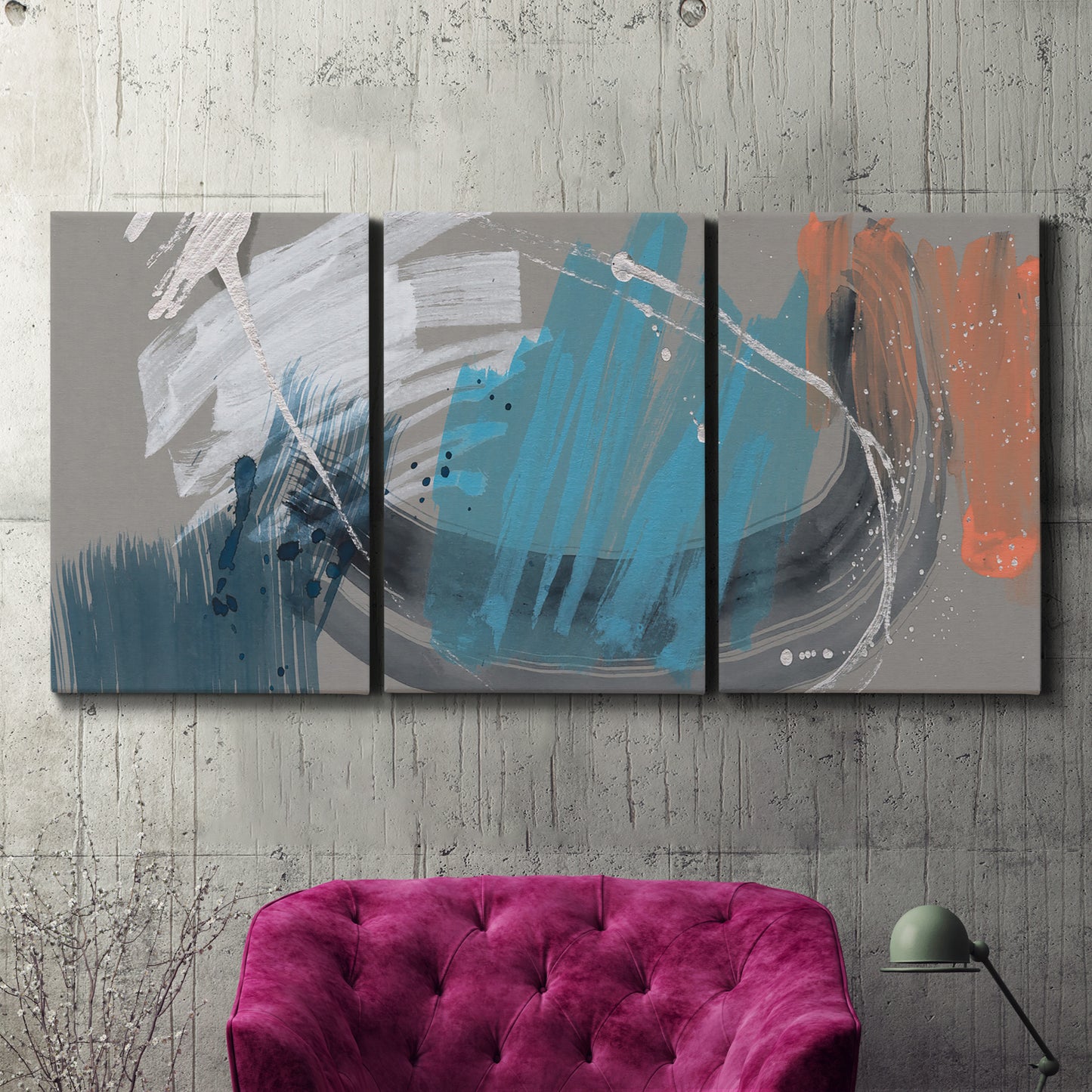 Three-panel canvas wall art featuring playful abstract mark making, displayed in a living room above a suede accent chair.