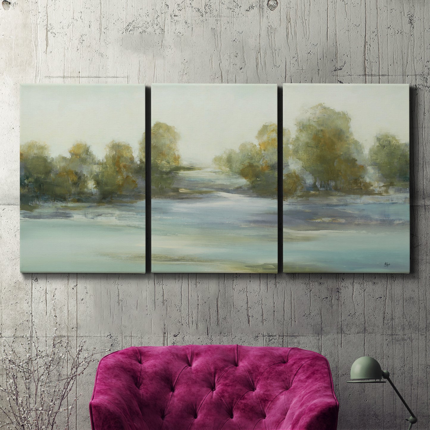 Three-panel canvas wall art featuring calming scenic landscape view, displayed in a living room above a suede accent chair.